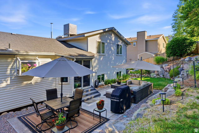 11875 South Elm Ridge Road Sandy, UT 84094 - Photo 50 of 53 Rear exterior featuring a multi-level patio with stone accents