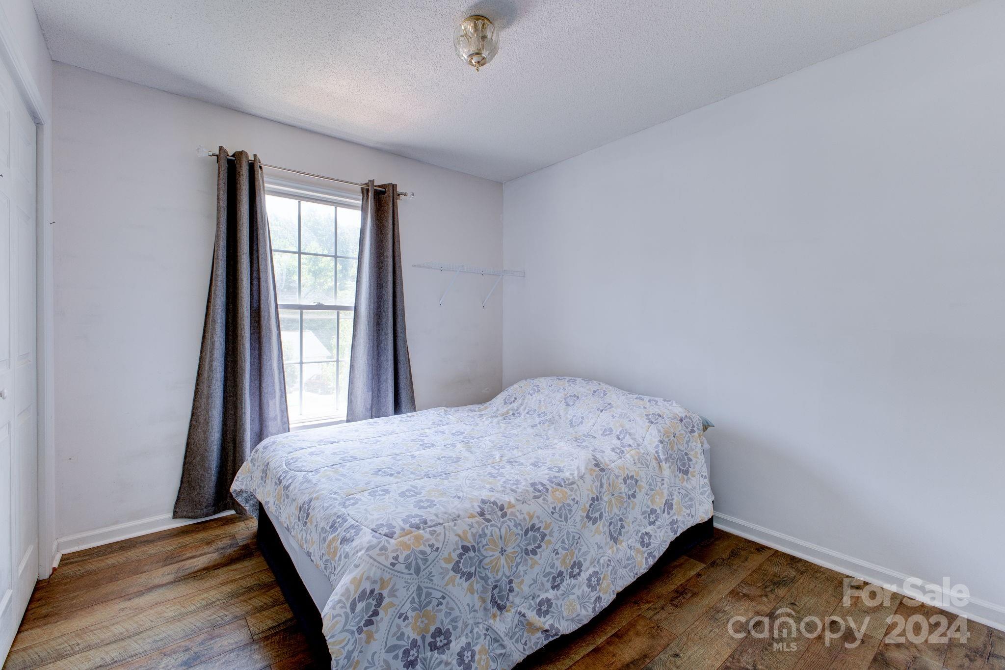 1204 Coventry Place Northwest Conover, NC 28613 - Photo 13 of 17 a bedroom with a bed and a window