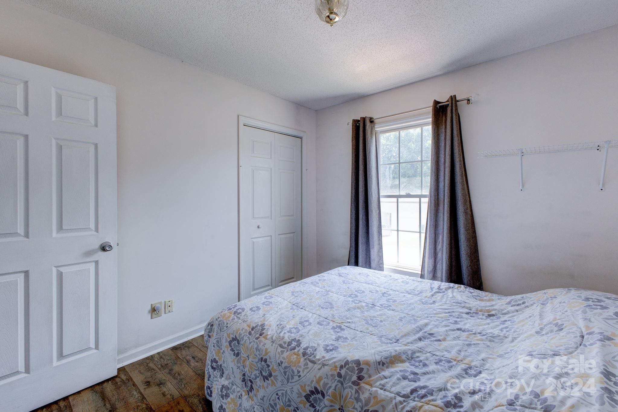 1204 Coventry Place Northwest Conover, NC 28613 - Photo 14 of 17 a bedroom with a bed and a window