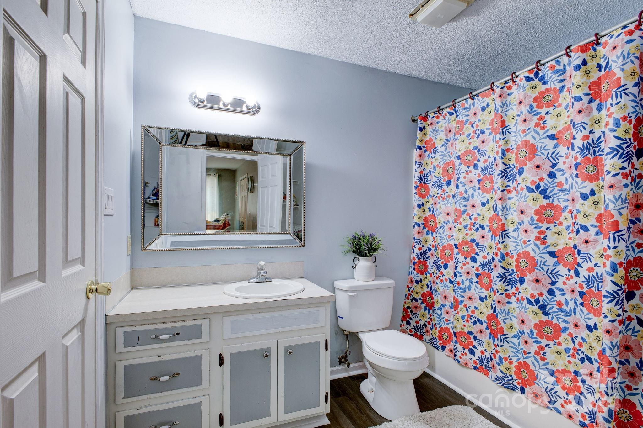 1204 Coventry Place Northwest Conover, NC 28613 - Photo 15 of 17 a bathroom with a sink toilet and shower