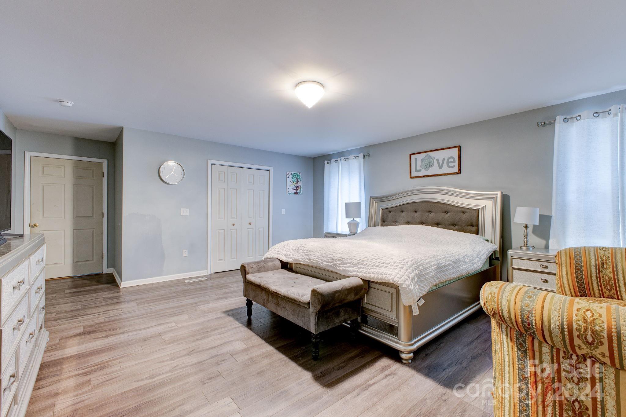 1204 Coventry Place Northwest Conover, NC 28613 - Photo 16 of 17 a spacious bedroom with a bed and a couch