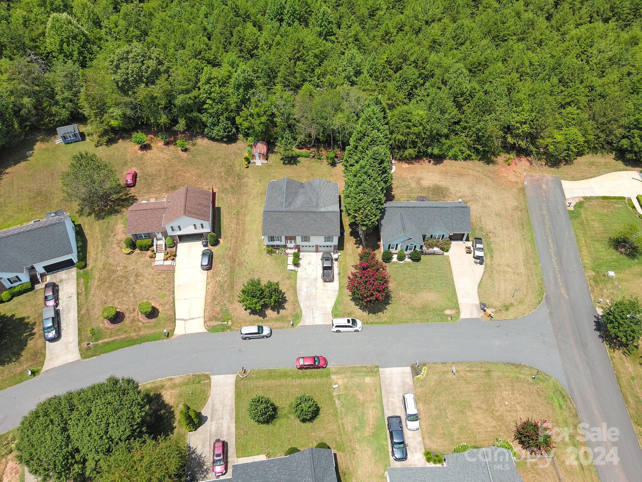 1204 Coventry Place Northwest Conover, NC 28613 - Photo 4 of 17 an aerial view of residential houses with outdoor space and trees