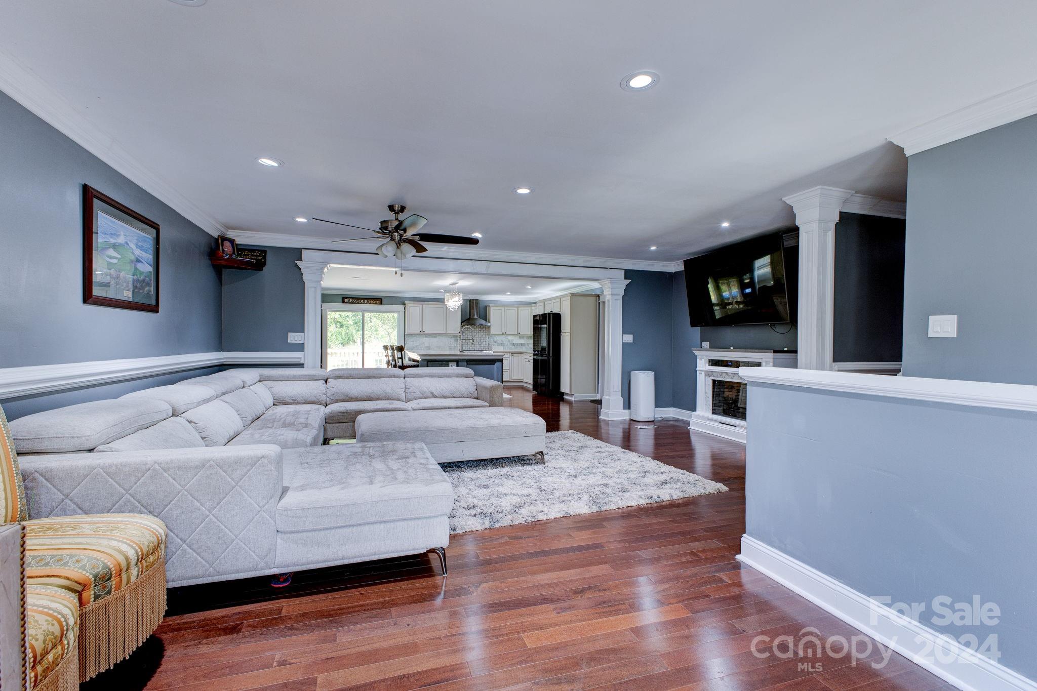 1204 Coventry Place Northwest Conover, NC 28613 - Photo 5 of 17 a living room with furniture and a flat screen tv