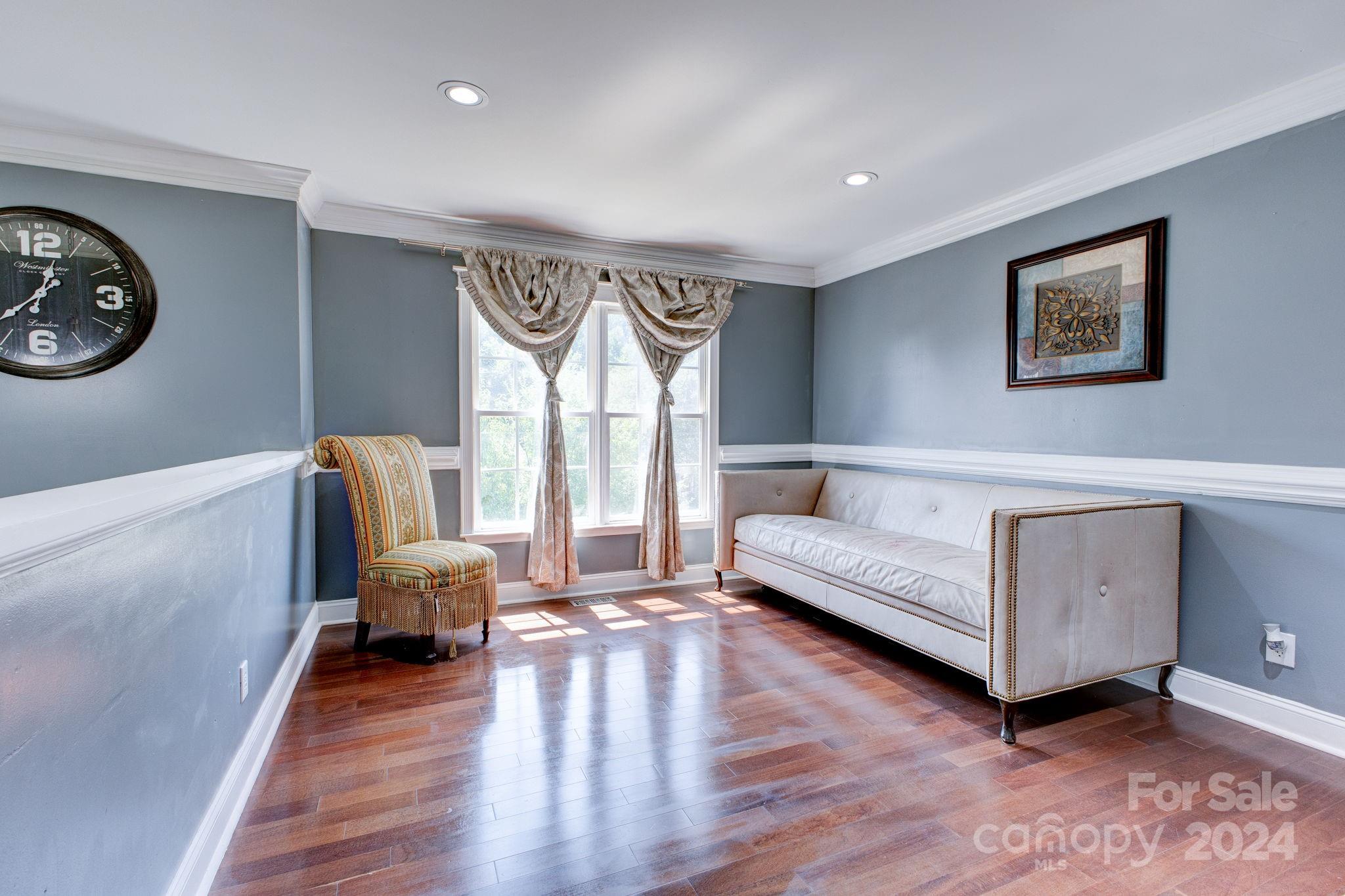 1204 Coventry Place Northwest Conover, NC 28613 - Photo 6 of 17 a living room with furniture and a wooden floor
