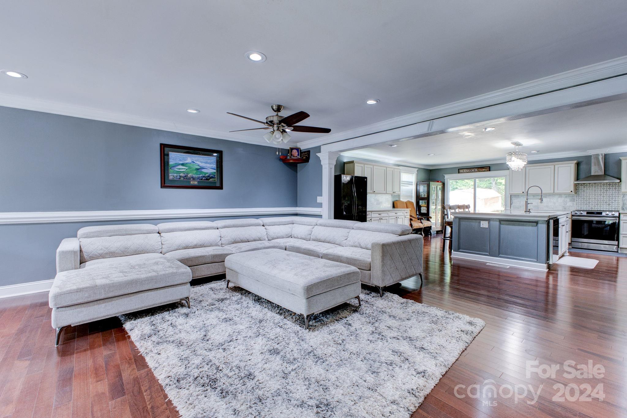 1204 Coventry Place Northwest Conover, NC 28613 - Photo 7 of 17 a living room with furniture and a wooden floor