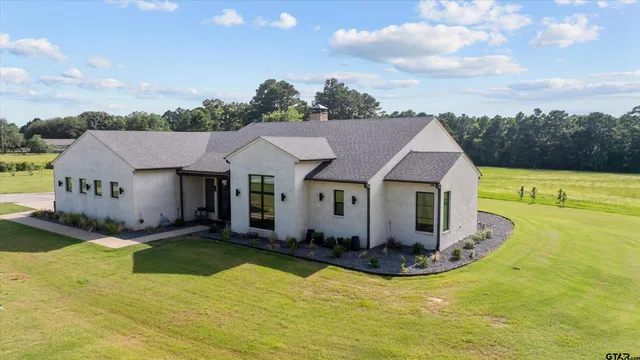 a view of a house with a big yard