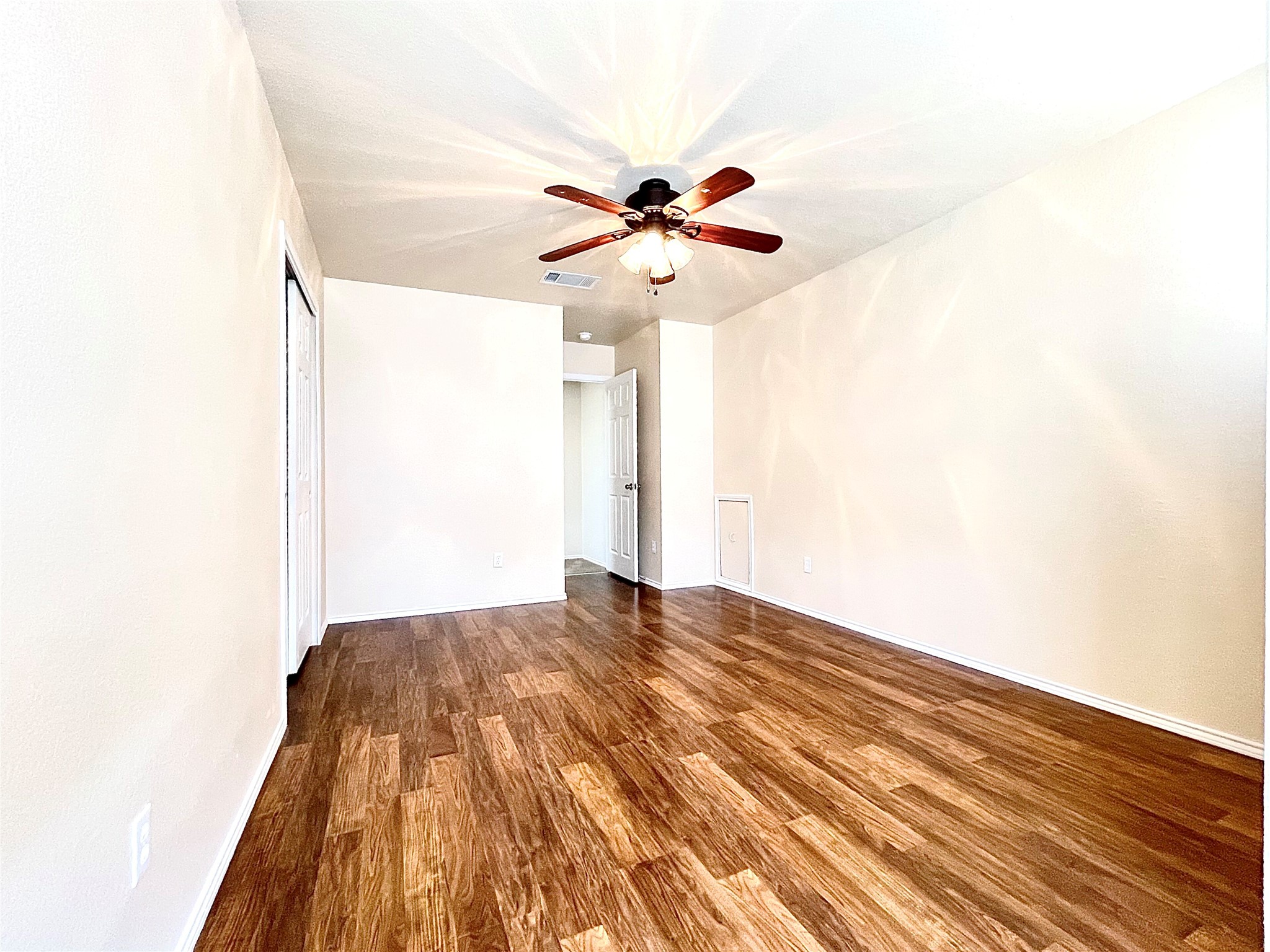 508 Emma Rose Trail Leander, TX 78641 - Photo 26 of 40 Warm wood flooring extends throughout this versatile, well-lit room, featuring a central ceiling fan for comfort.