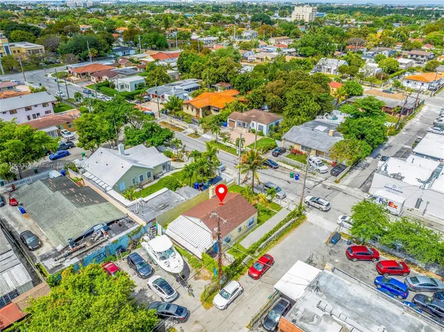 an aerial view of residential houses with outdoor space