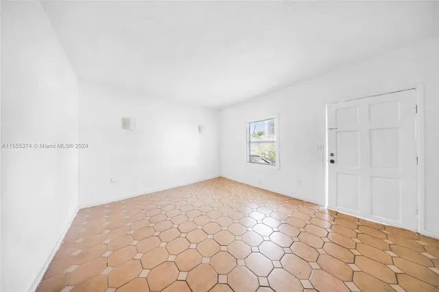 a view of a room with white walls