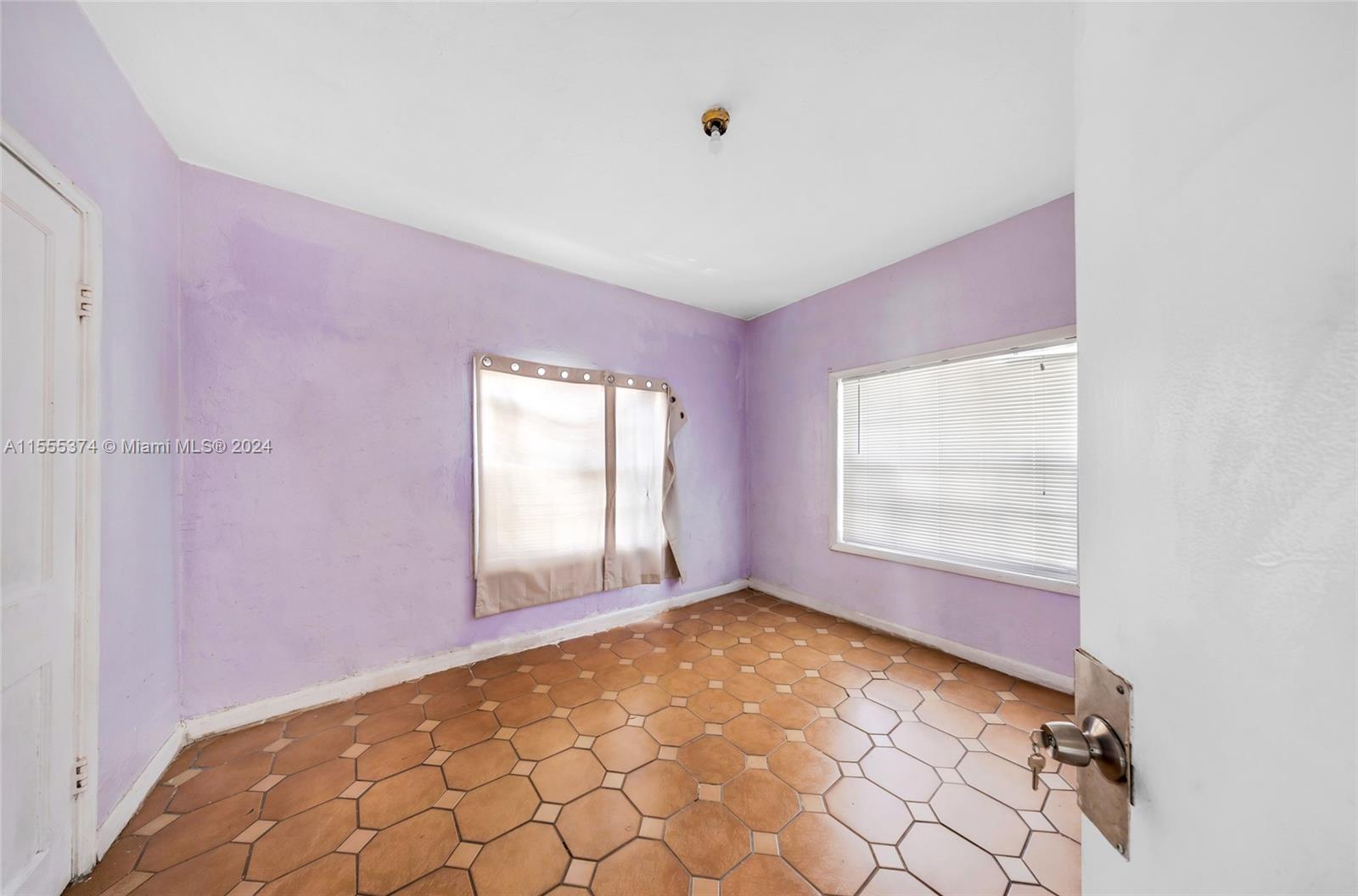 2728 Northwest 3rd Street Miami, FL 33125 - Photo 28 of 33 an empty room with windows