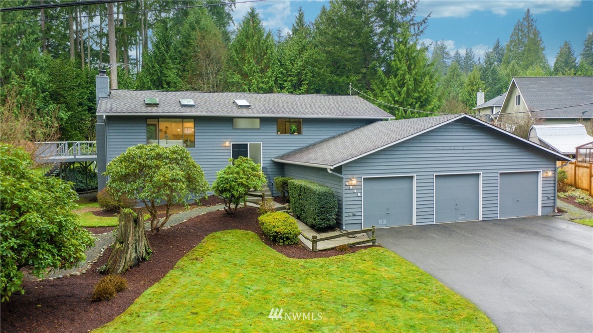4908 200th Street Southeast Bothell, WA 98012 - Photo 2 of 29 a view of a house with a yard and plants