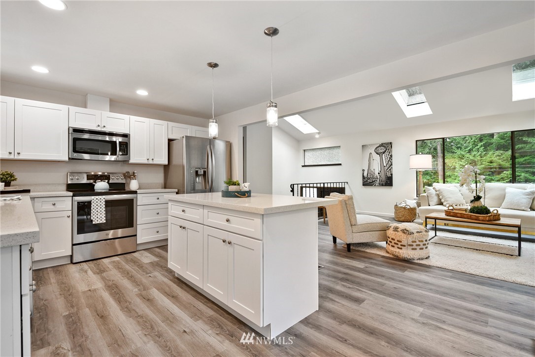 4908 200th Street Southeast Bothell, WA 98012 - Photo 11 of 29 a kitchen with white cabinets and appliances