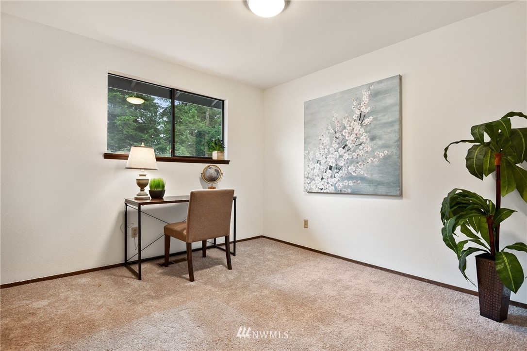 4908 200th Street Southeast Bothell, WA 98012 - Photo 14 of 29 a workspace with furniture and a window