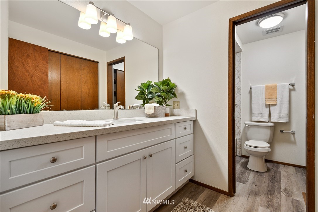 4908 200th Street Southeast Bothell, WA 98012 - Photo 17 of 29 a bathroom with a toilet sink and mirror