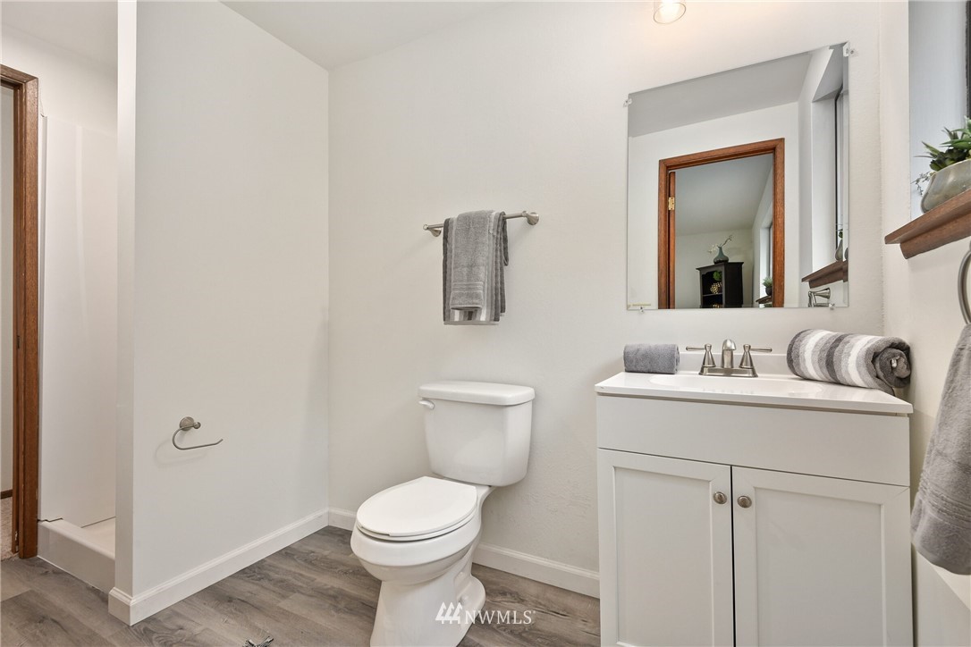 4908 200th Street Southeast Bothell, WA 98012 - Photo 20 of 29 a bathroom with a toilet sink and mirror