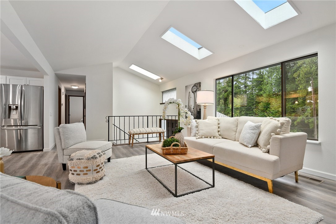 4908 200th Street Southeast Bothell, WA 98012 - Photo 5 of 29 a living room with furniture and a large window