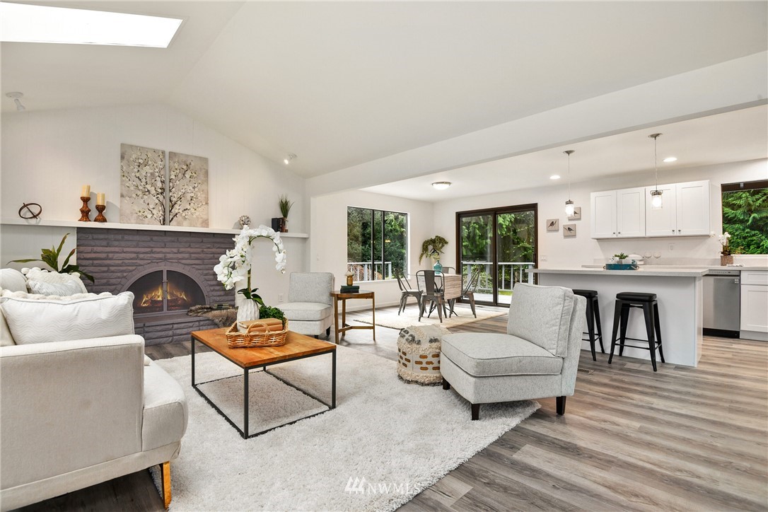 4908 200th Street Southeast Bothell, WA 98012 - Photo 7 of 29 a living room with furniture and a fireplace