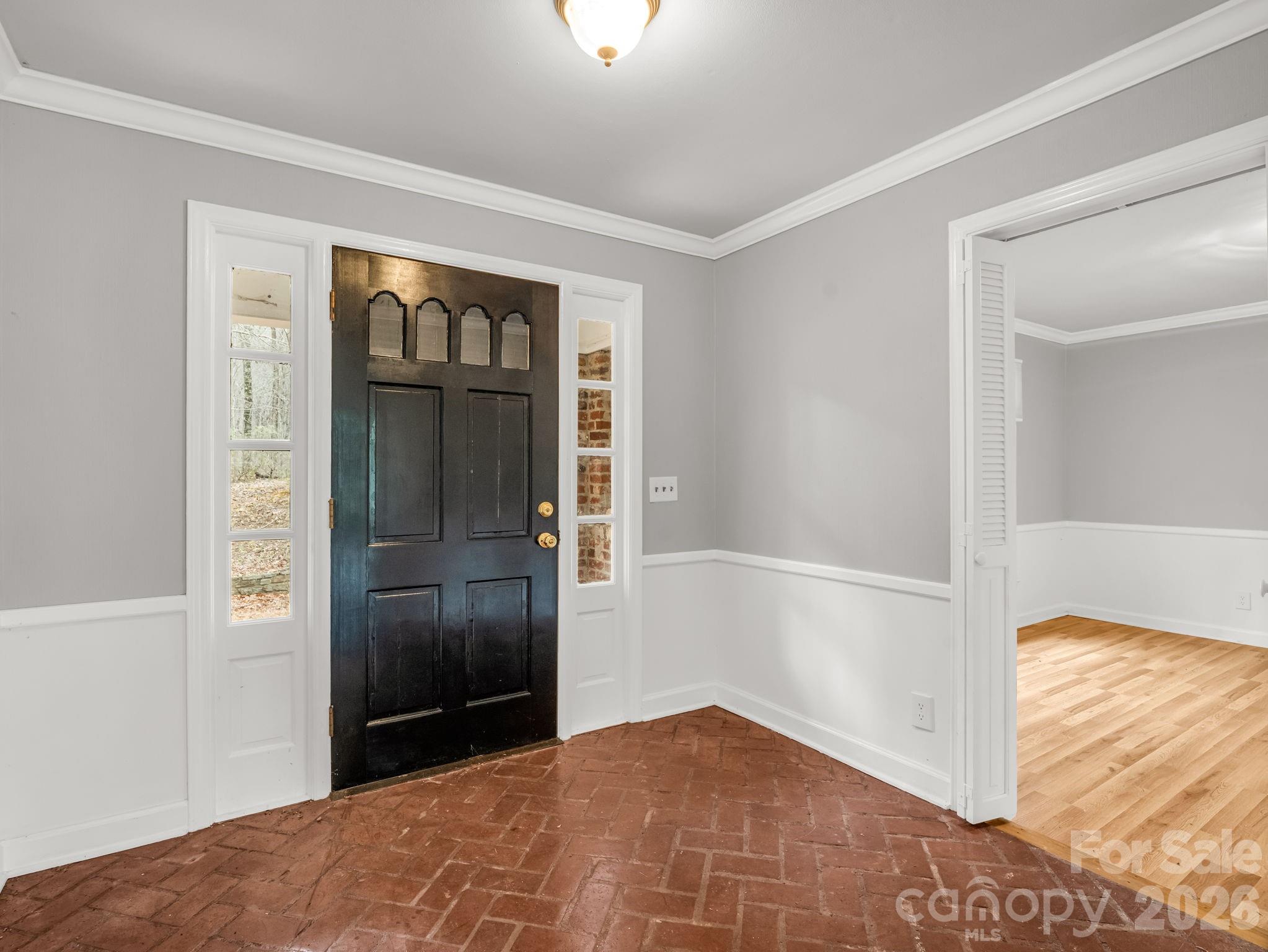 117 Hummingbird Lane Columbus, NC 28722 - Photo 11 of 32 a view of hallway with window and entryway
