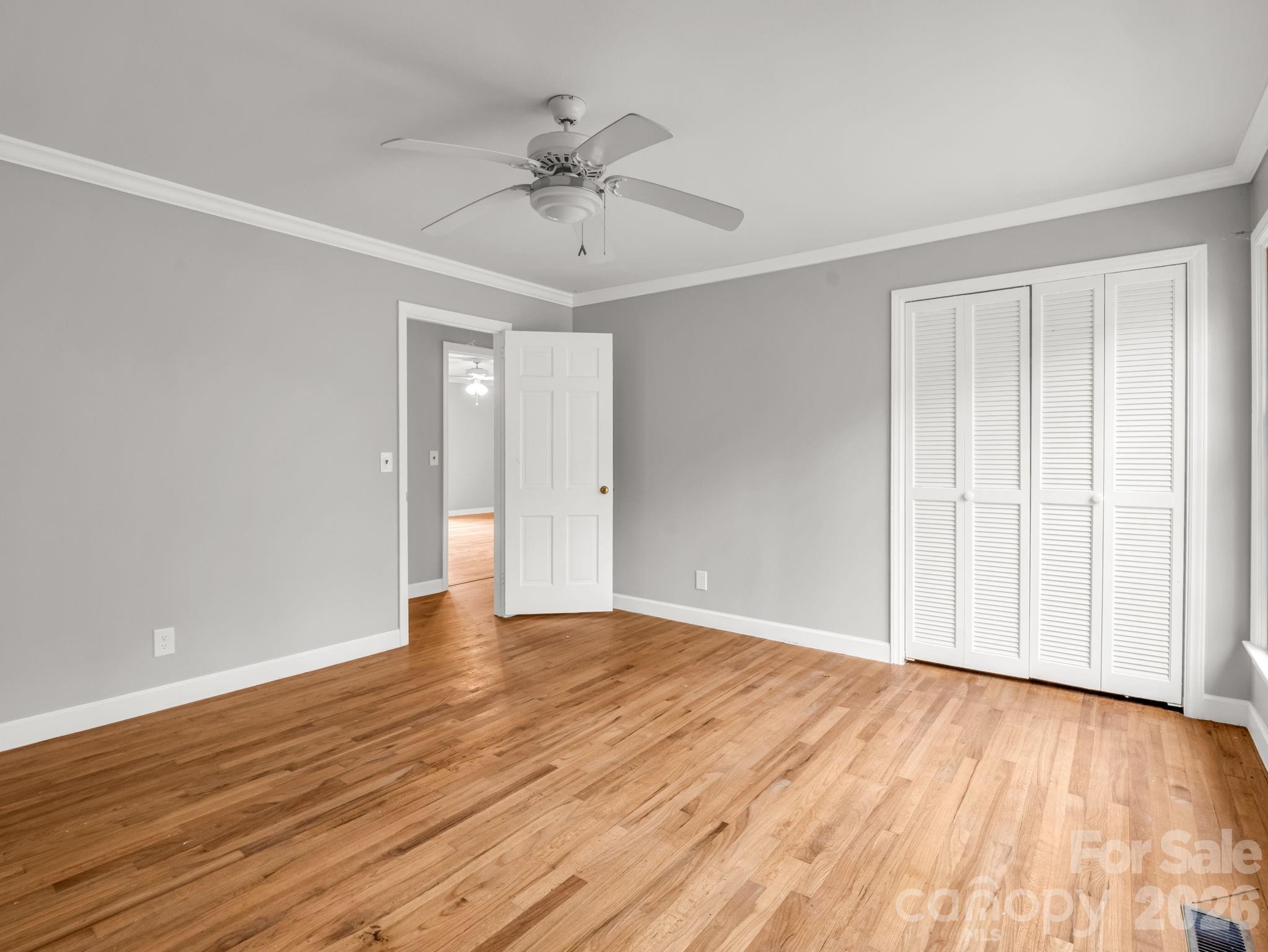 117 Hummingbird Lane Columbus, NC 28722 - Photo 25 of 32 a view of an empty room with wooden floor