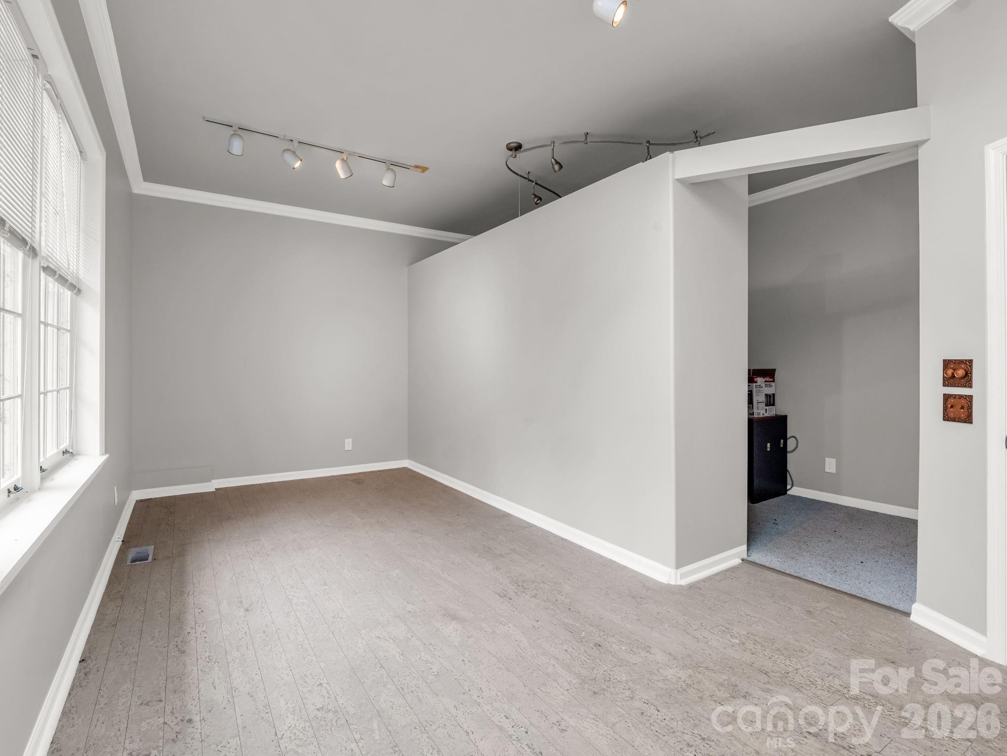 117 Hummingbird Lane Columbus, NC 28722 - Photo 29 of 32 an empty room with a natural light