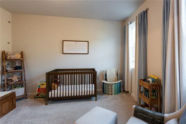 a bathroom with a toilet a sink and a mirror