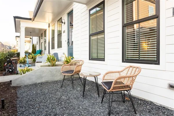 a view of a chairs and table in the patio
