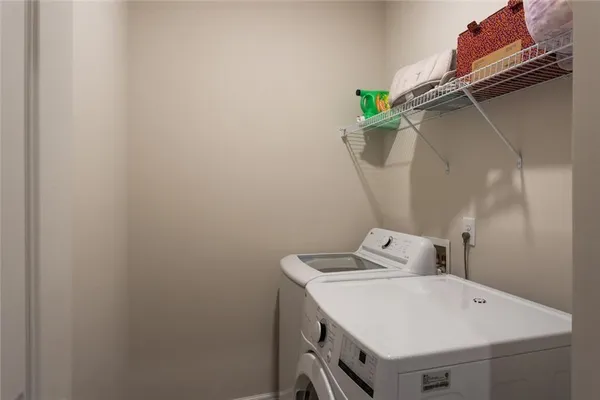 a view of hallway with washer and dryer