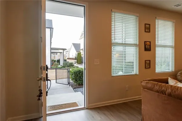 a view of a livingroom with workspace and a window