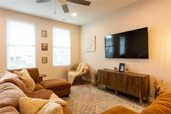 a living room with furniture and a flat screen tv