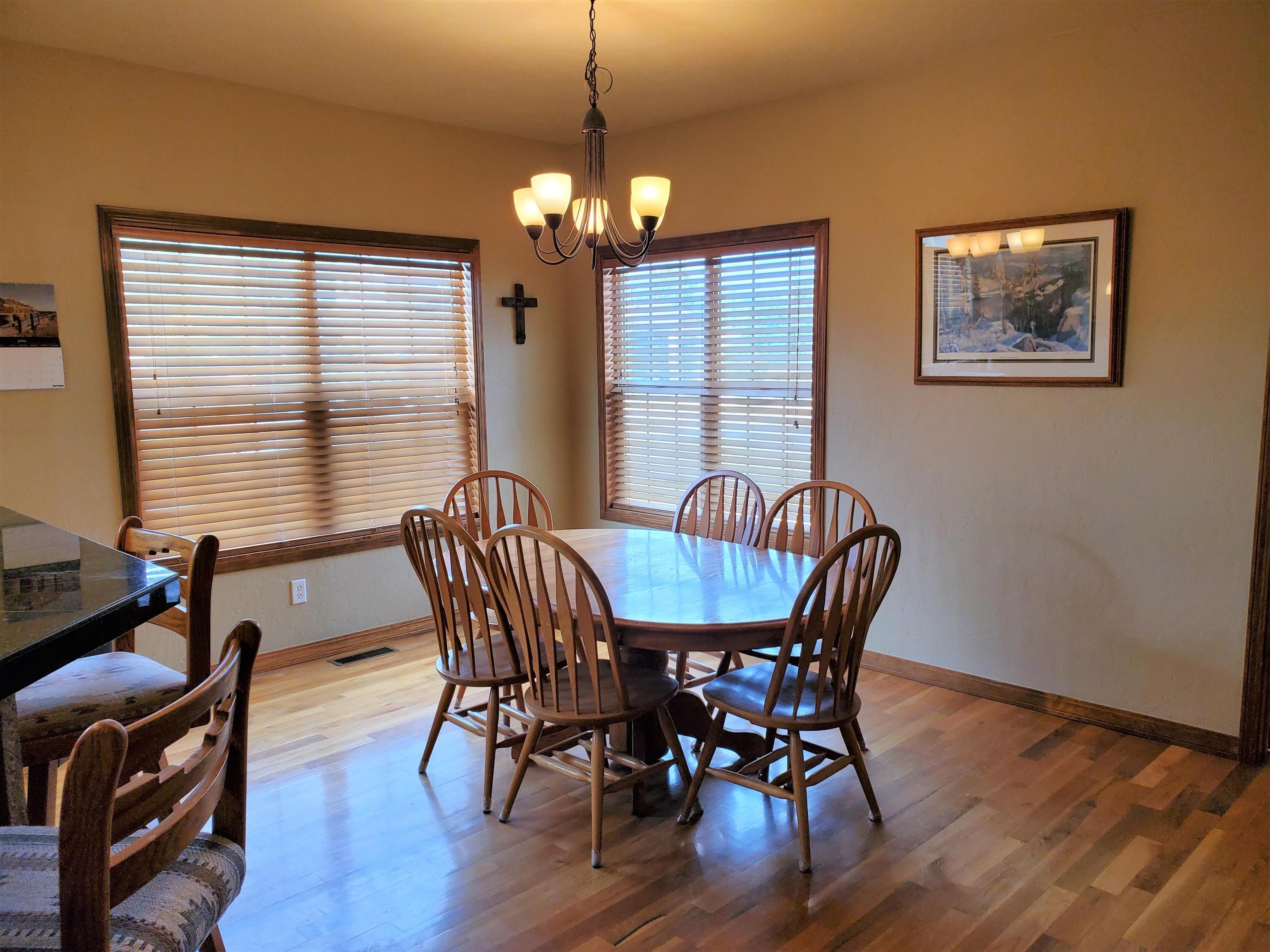 800 Esprit Lane Fruita, CO 81521 - Photo 14 of 38 a view of a dining room with furniture window and wooden floor