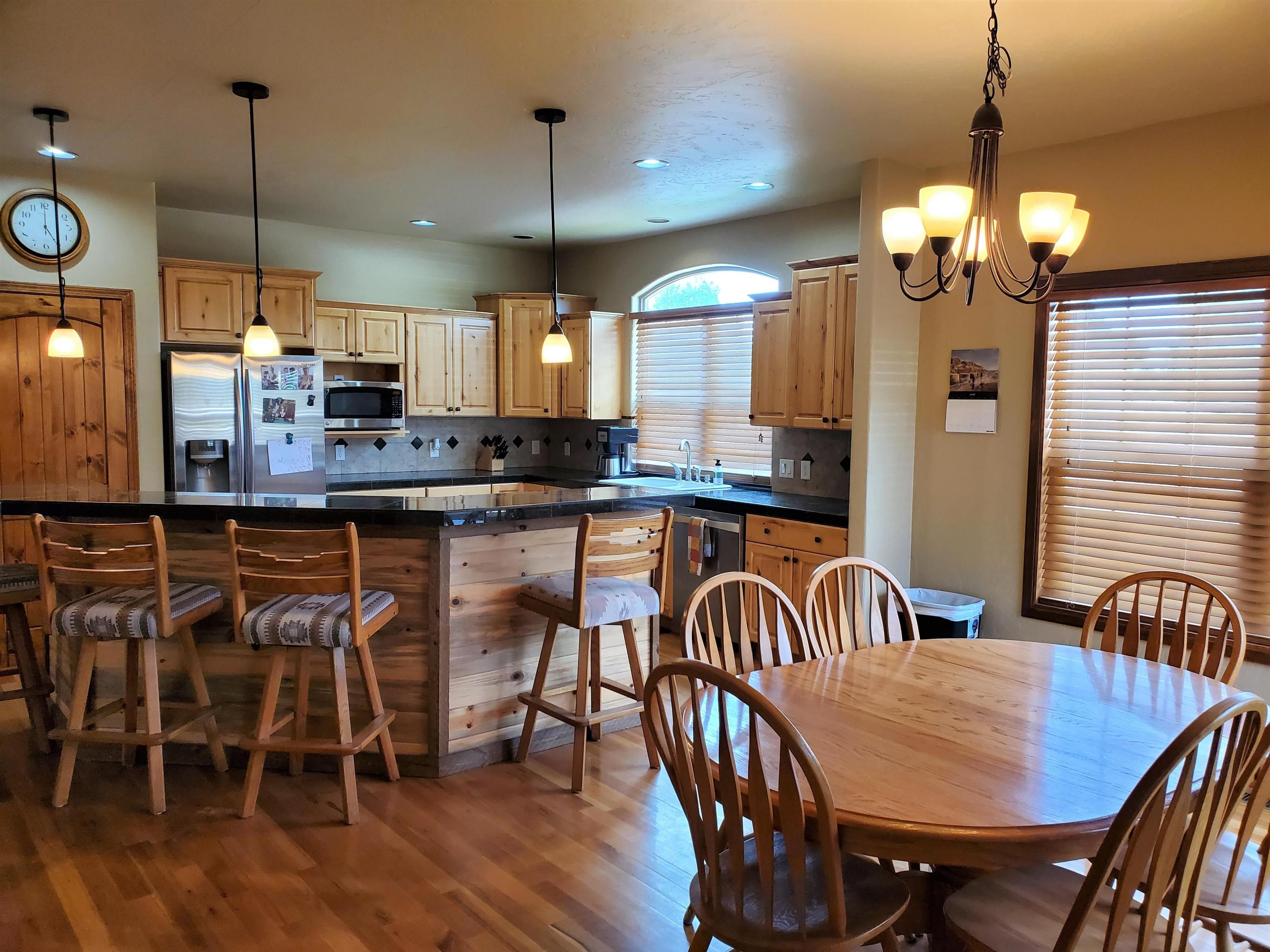 800 Esprit Lane Fruita, CO 81521 - Photo 16 of 38 a view of a dining room with furniture window and wooden floor