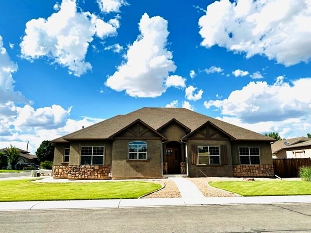 800 Esprit Lane Fruita, CO 81521 - Photo 2 of 38 a front view of a house with a yard