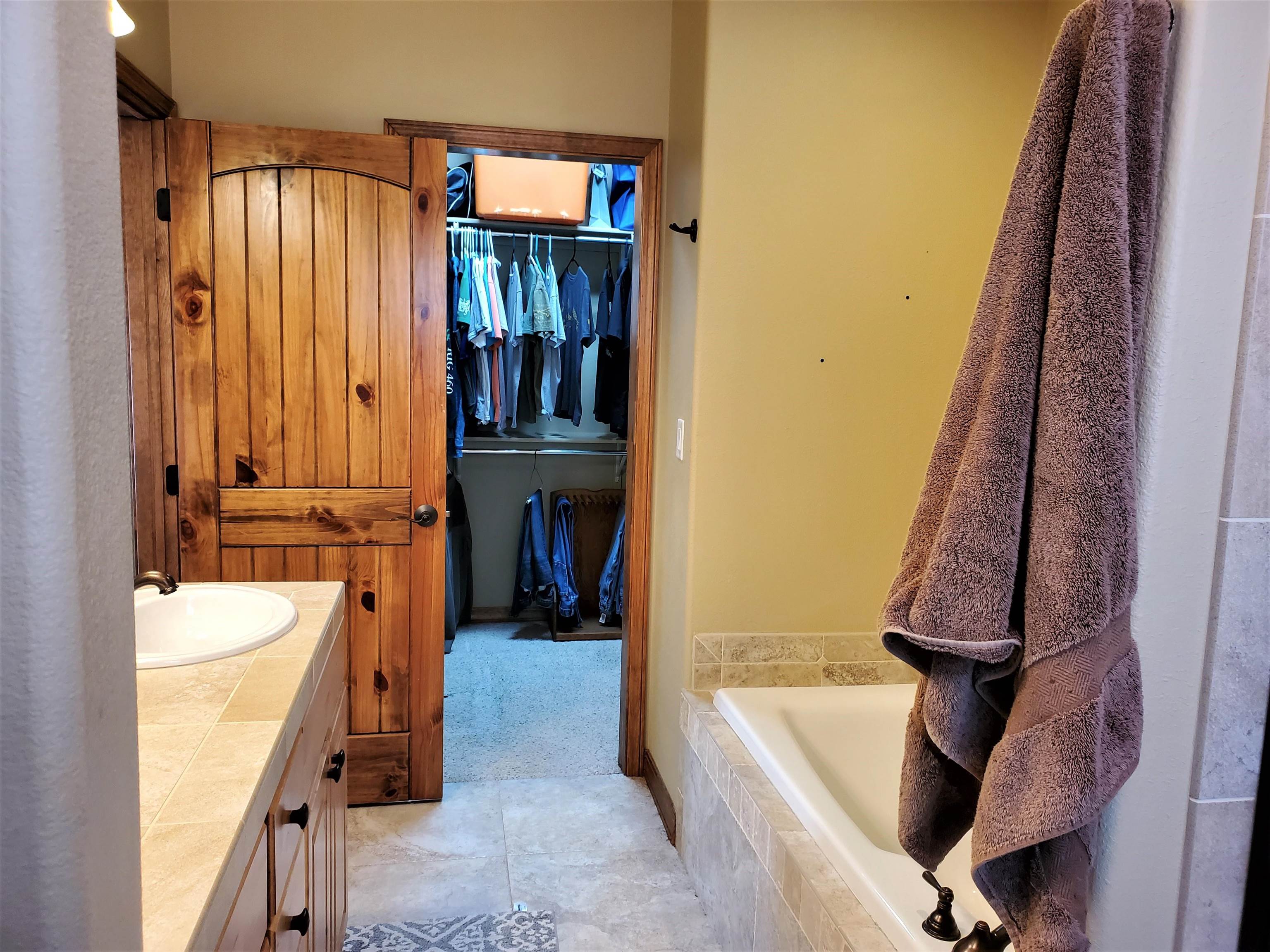 800 Esprit Lane Fruita, CO 81521 - Photo 22 of 38 a view of walk in closet with clothes and shoes