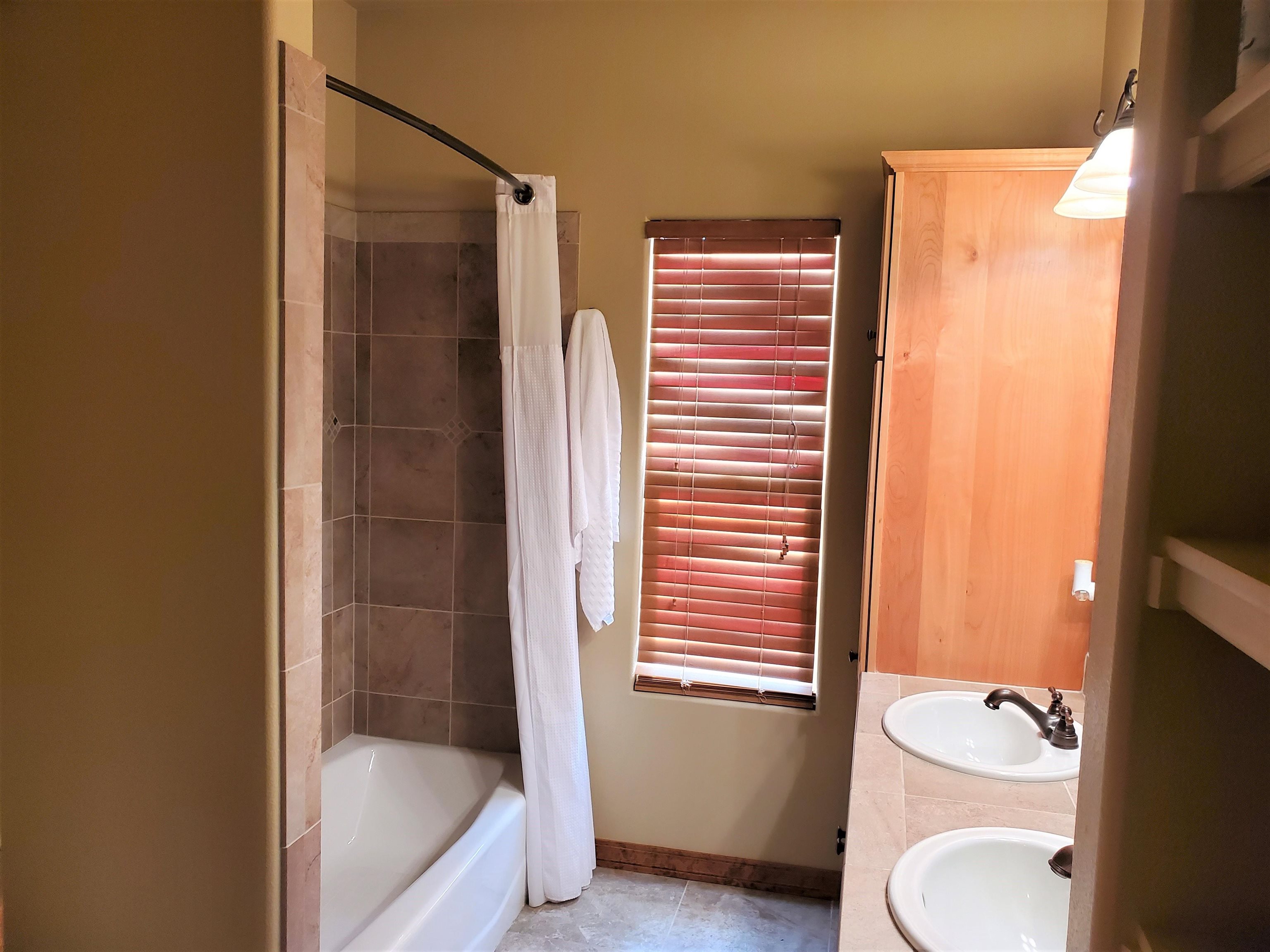 800 Esprit Lane Fruita, CO 81521 - Photo 25 of 38 a bathroom with a granite countertop sink toilet and shower