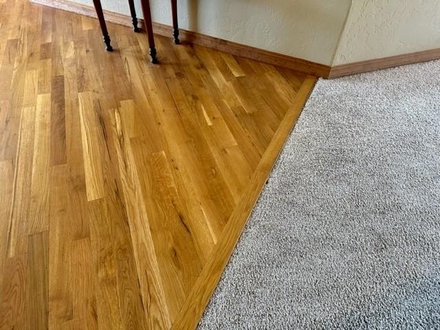 800 Esprit Lane Fruita, CO 81521 - Photo 29 of 38 a view of an empty room with wooden floor