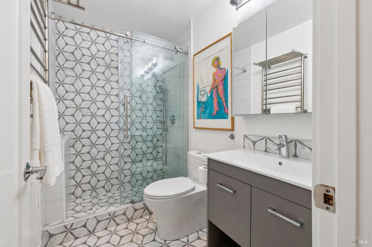 1045 Susan Way Novato, CA 94947 - Photo 53 of 62 Full bathroom on the lower floor featuring heated towel racks, heated floors, and a stylish walk-in shower.