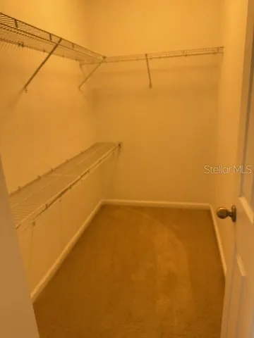 a view of a small space with racks on the wall