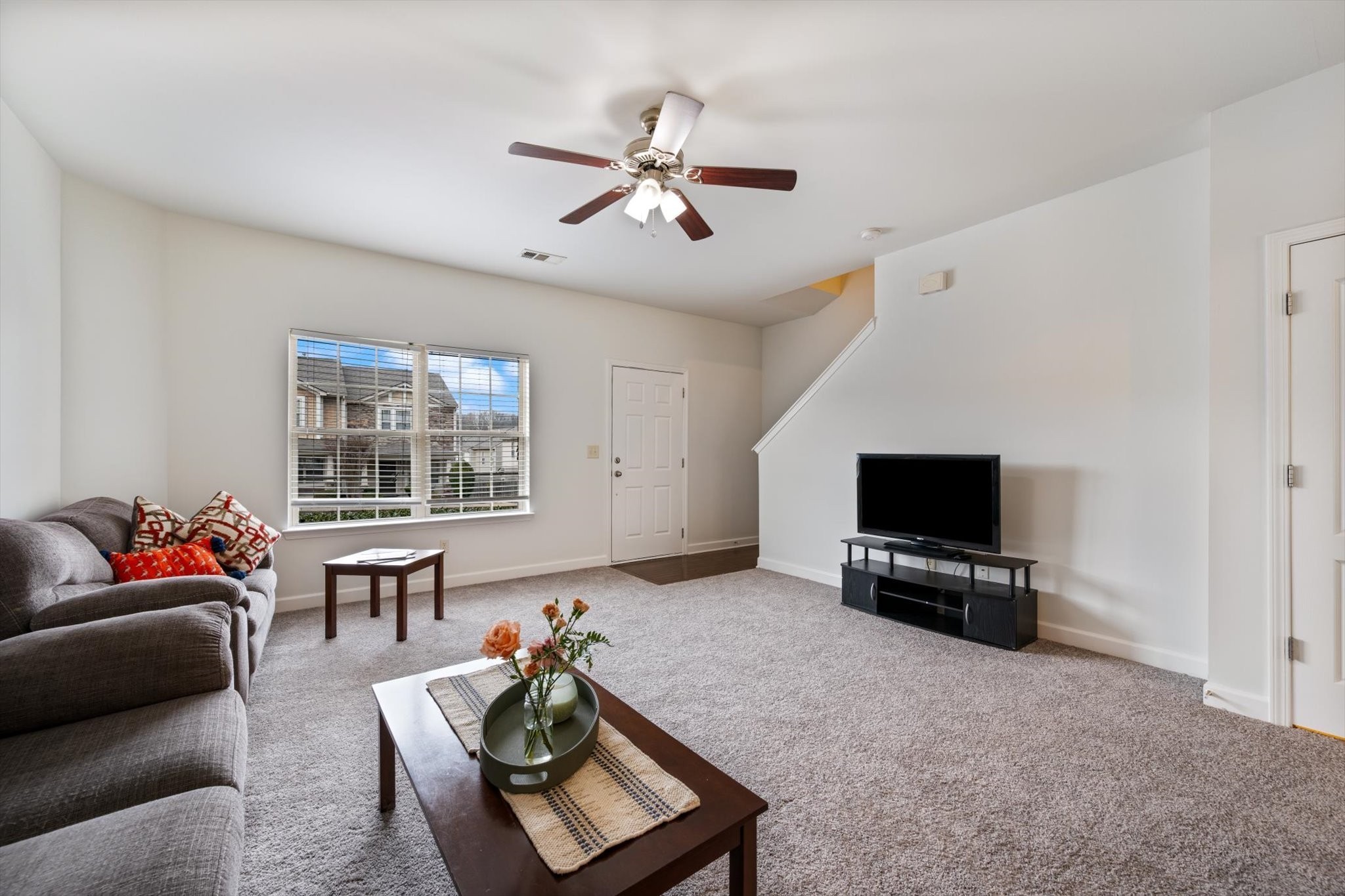 735 Tulip Grove Road, Unit 311 Hermitage, TN 37076 - Photo 4 of 22 a living room with furniture and a flat screen tv
