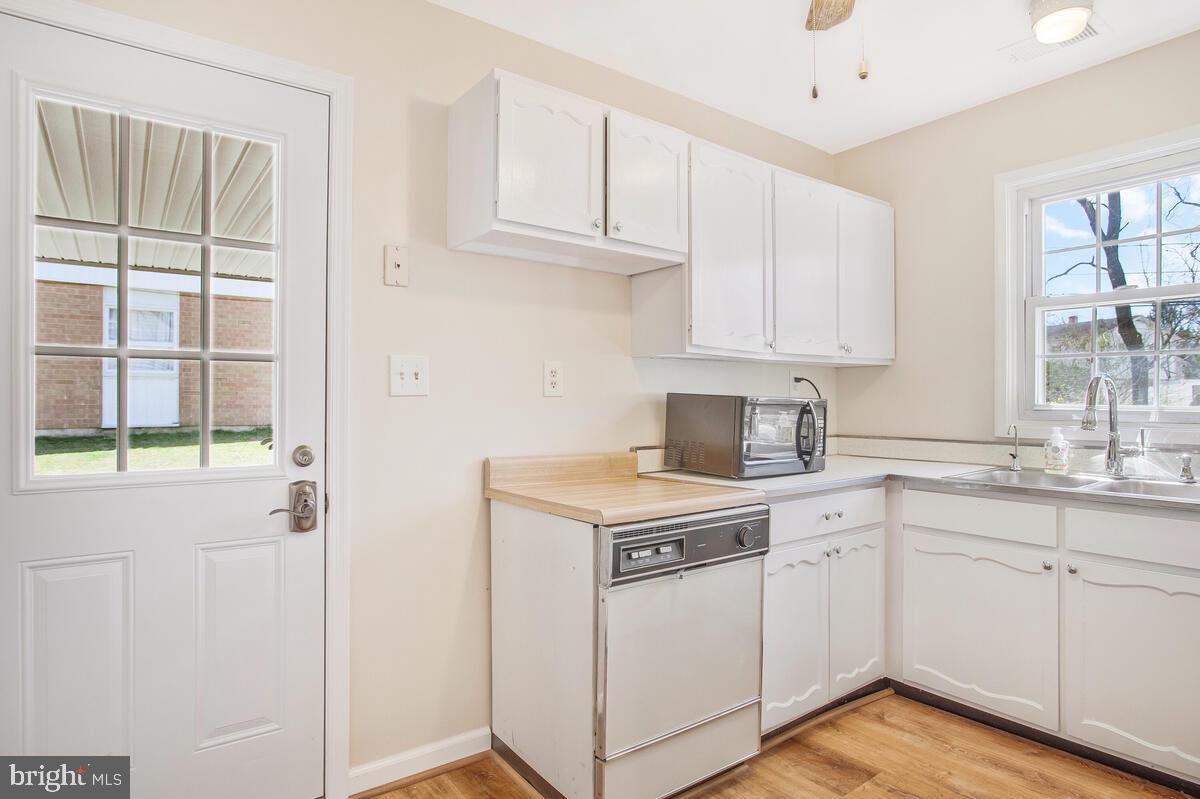 830 Joppa Farm Road Joppa, MD 21085 - Photo 14 of 41 a kitchen with cabinets appliances and a window