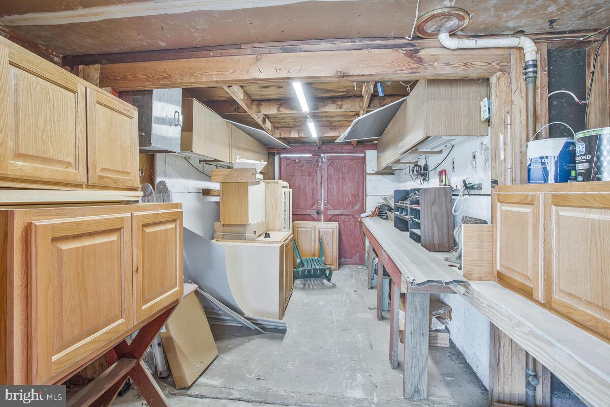 830 Joppa Farm Road Joppa, MD 21085 - Photo 18 of 41 a storage room with cabinets washer and dryer