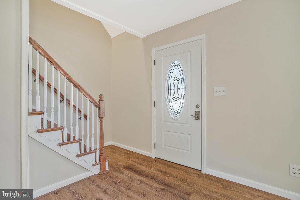 830 Joppa Farm Road Joppa, MD 21085 - Photo 27 of 41 a view of a hallway with wooden floor and staircase