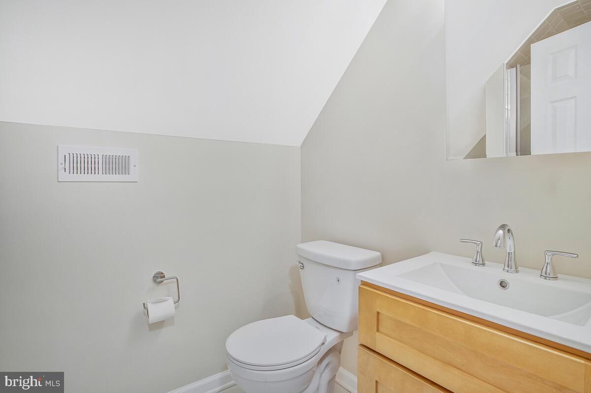 830 Joppa Farm Road Joppa, MD 21085 - Photo 30 of 41 a white toilet sitting next to a bathroom sink