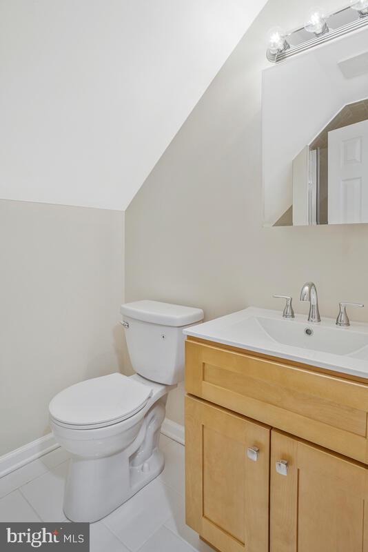 830 Joppa Farm Road Joppa, MD 21085 - Photo 31 of 41 a bathroom with a sink a toilet and mirror