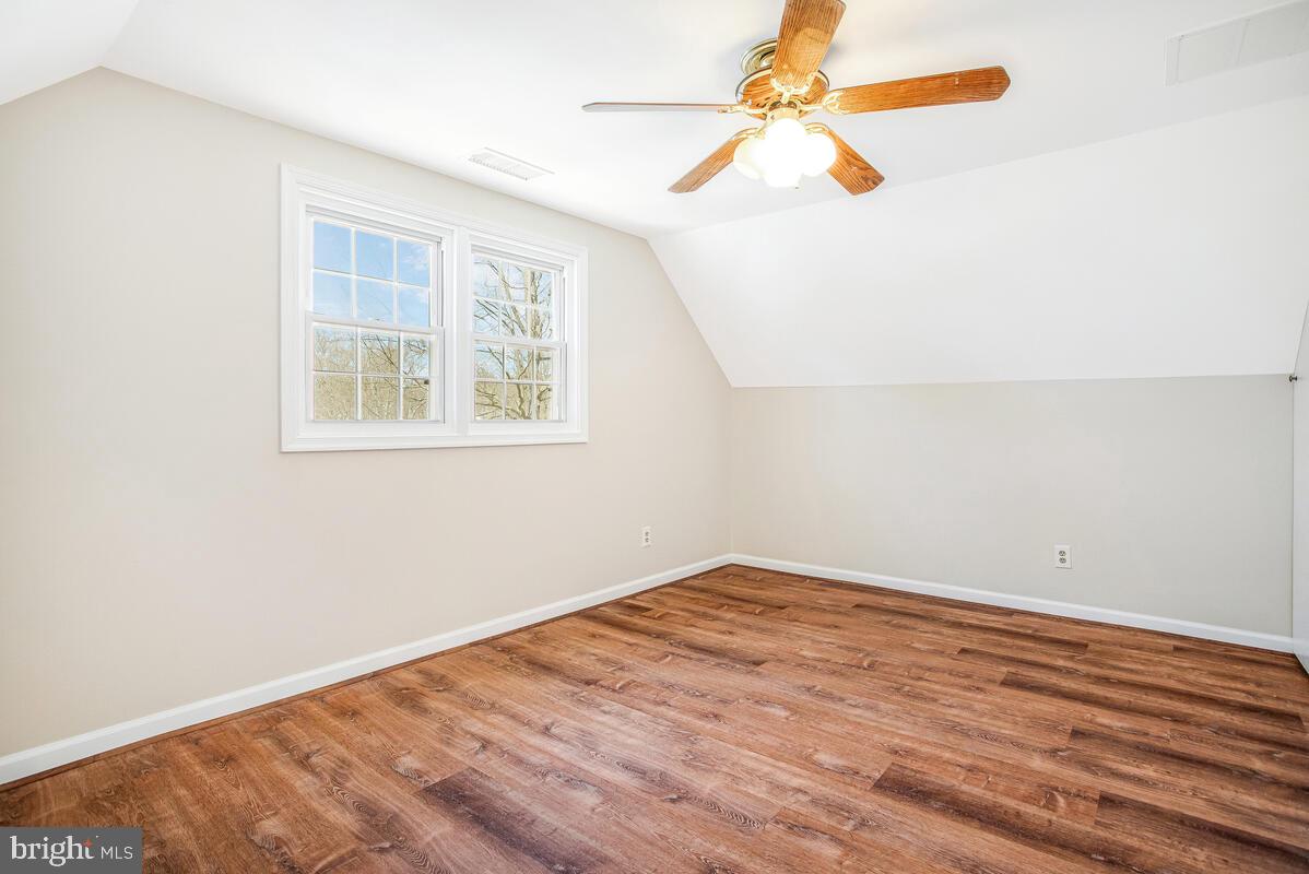 830 Joppa Farm Road Joppa, MD 21085 - Photo 33 of 41 an empty room with a window and a fan