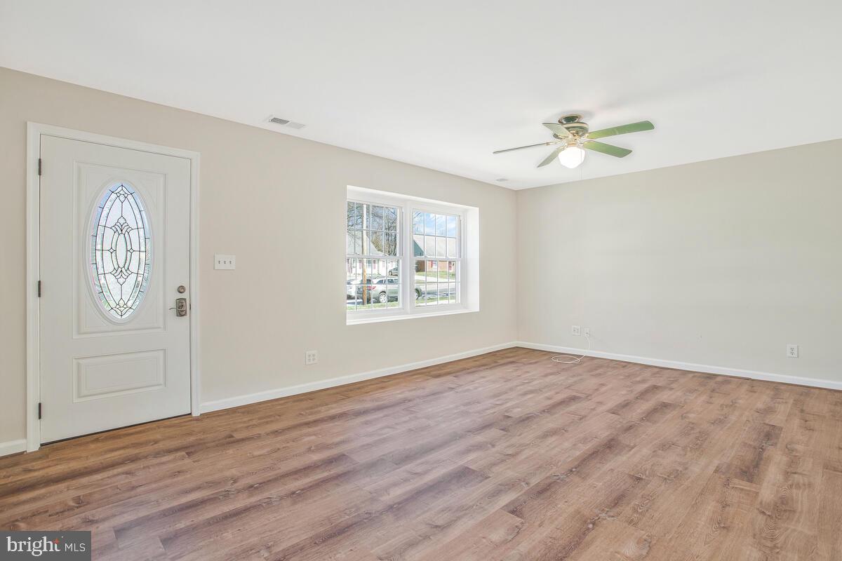 830 Joppa Farm Road Joppa, MD 21085 - Photo 5 of 41 wooden floor in an empty room with a window