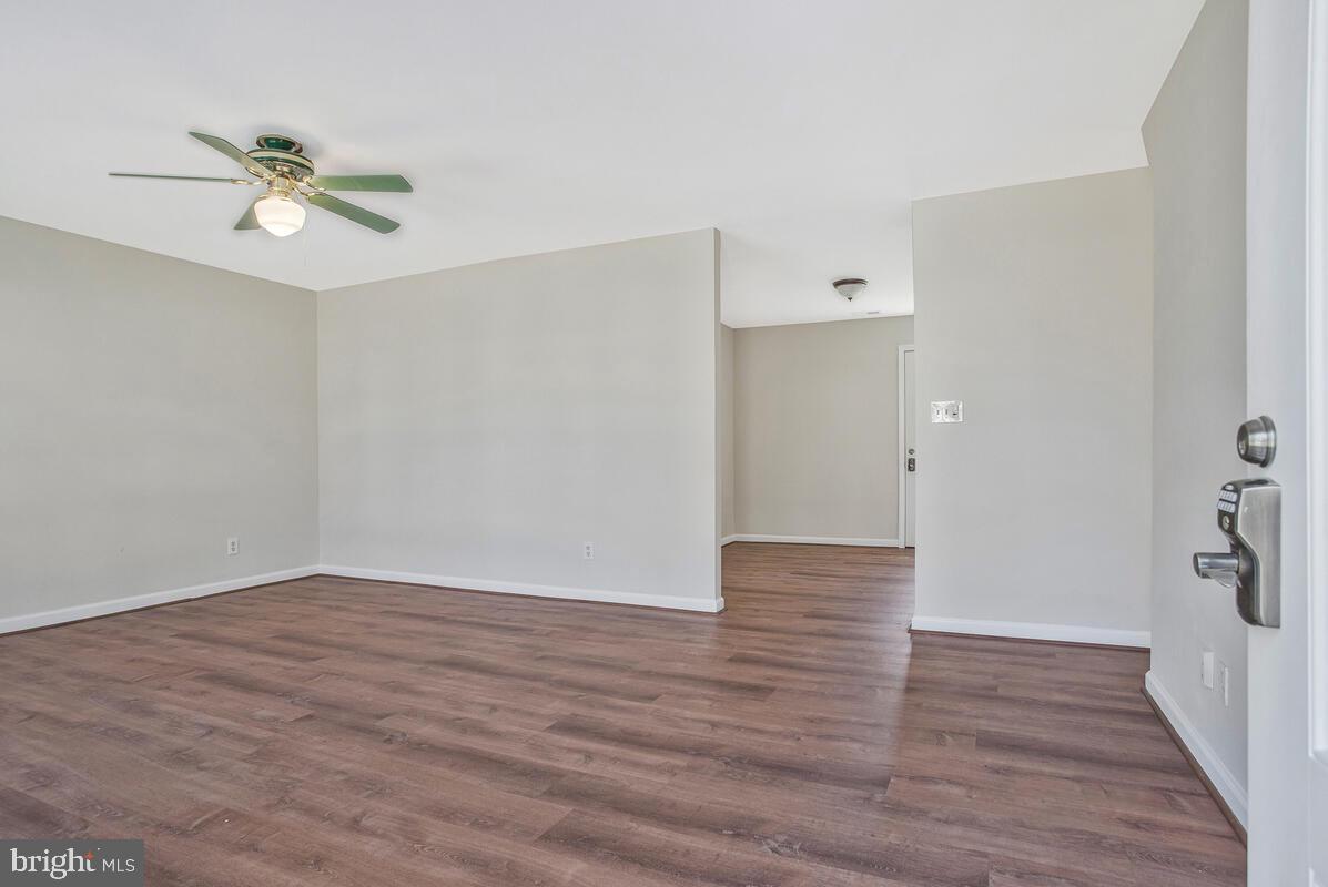 830 Joppa Farm Road Joppa, MD 21085 - Photo 7 of 41 a view of an empty room with wooden floor