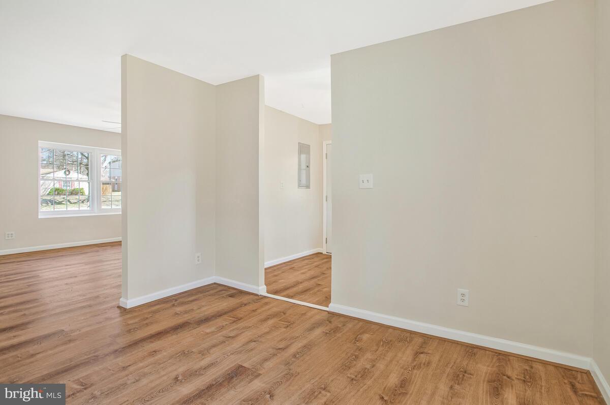 830 Joppa Farm Road Joppa, MD 21085 - Photo 10 of 41 a view of an empty room with wooden floor and a window