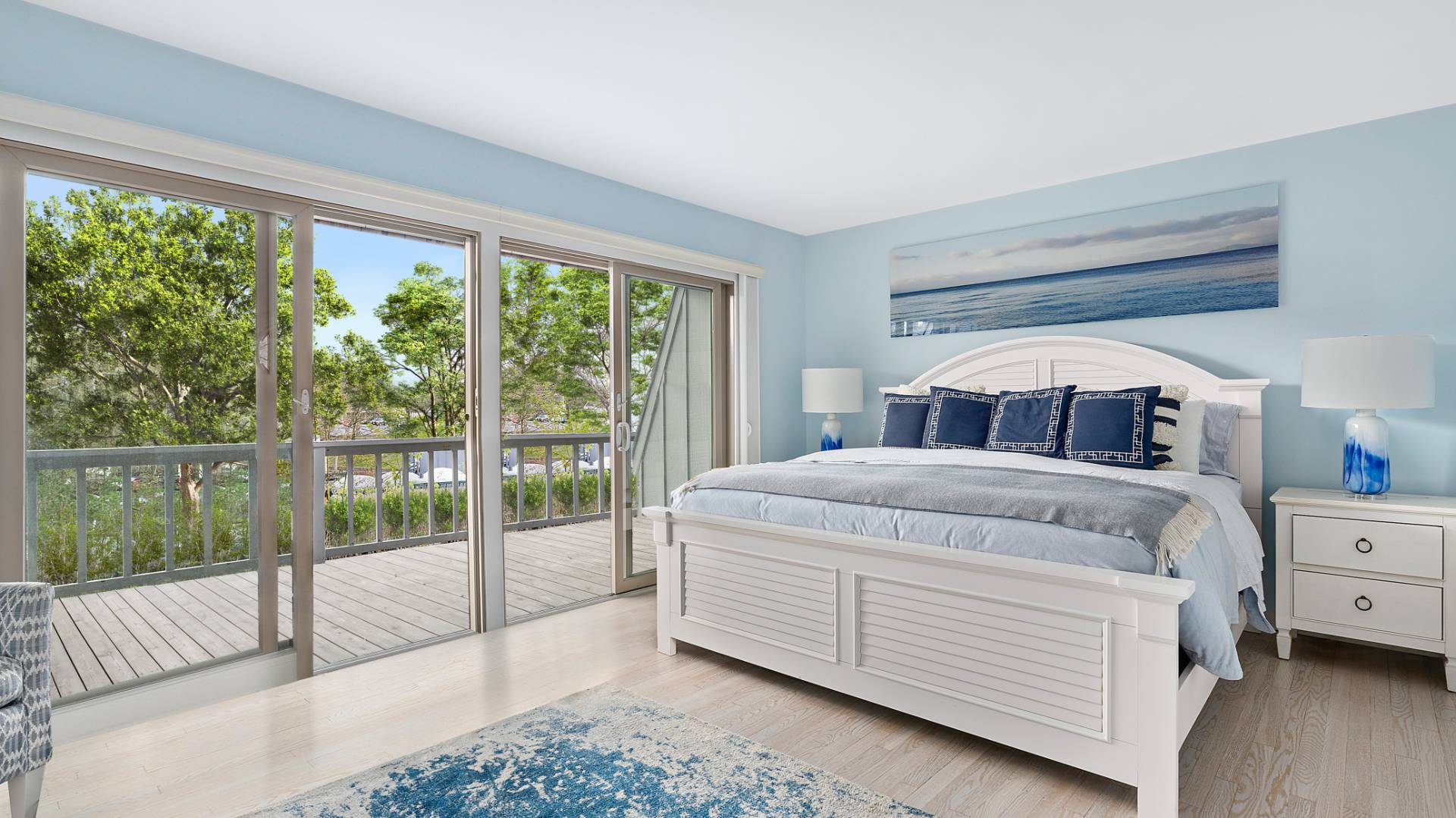 18 Bridge Street, Unit 4D Sag Harbor, NY 11963 - Photo 12 of 16 a bedroom with a large bed and a large window