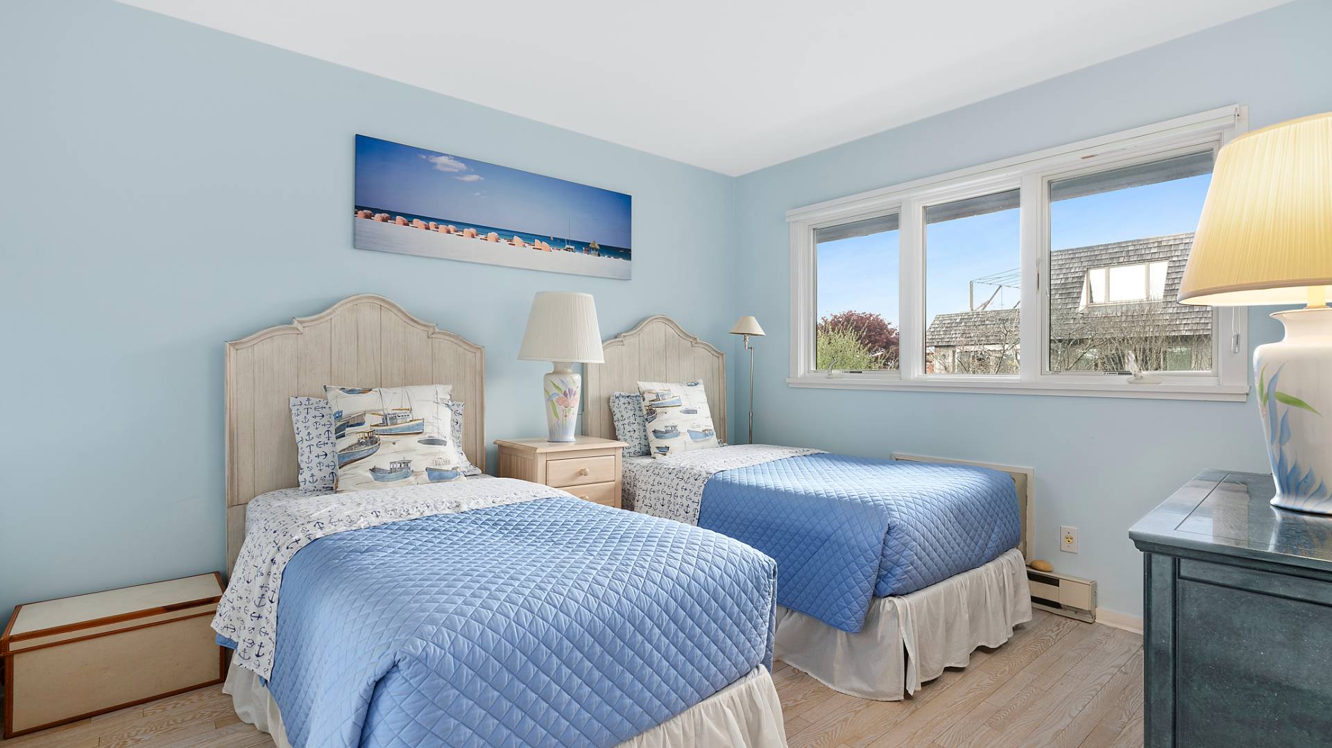 18 Bridge Street, Unit 4D Sag Harbor, NY 11963 - Photo 14 of 16 a bedroom with two beds and a large window
