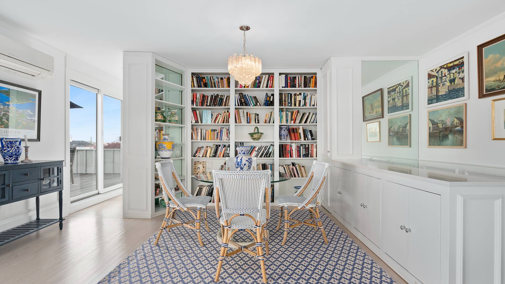 18 Bridge Street, Unit 4D Sag Harbor, NY 11963 - Photo 9 of 16 a view of a dining room with furniture and wooden floor